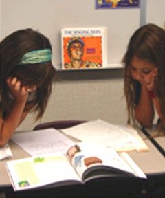 students reading a book